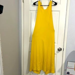 Bright yellow body con dress with a back cut out